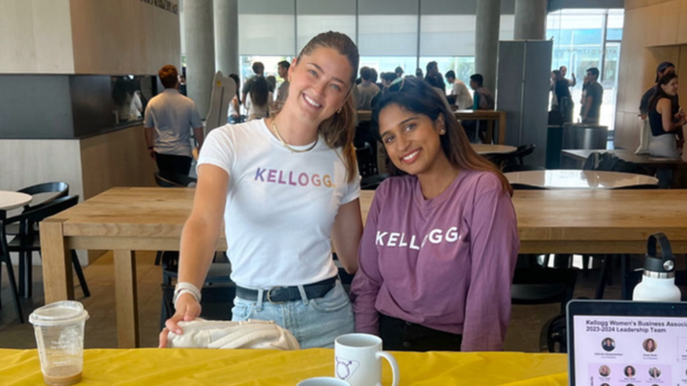 Two women wearing Kellogg apparel.