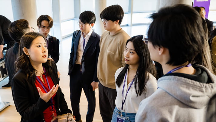 Jenny Xiao, a partner at Leonis Capital, chats AI trends with conference attendees after her panel discussion.