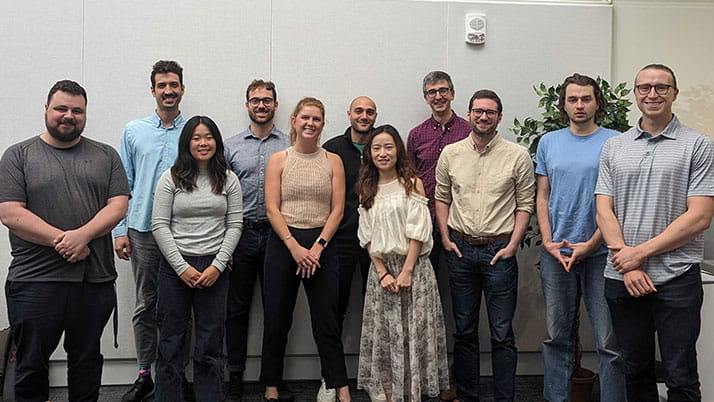Tessa Charlesworth (center left) alongside her colleague William Brady (center, middle) and Nour Kteily (middle center) and students who participated in their lab.