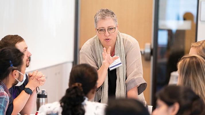 Faculty member Megan Kashner speaks to a group of students at Kellogg.