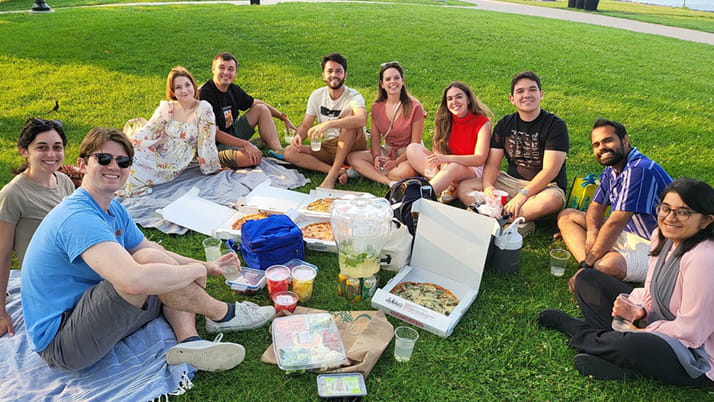Danny and his classmates and their partners enjoying a picnic on the Lakefill lawn.