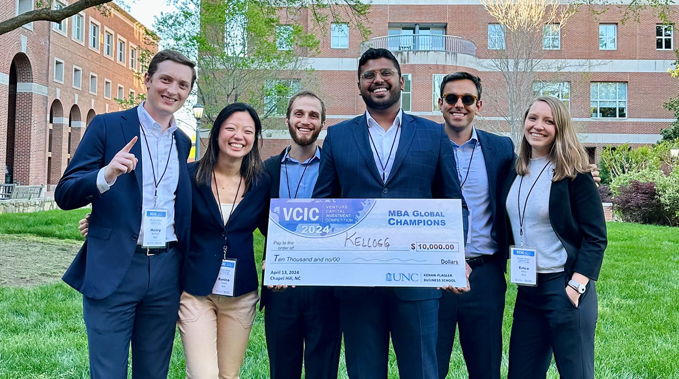 Kellogg MBA team holding prize check