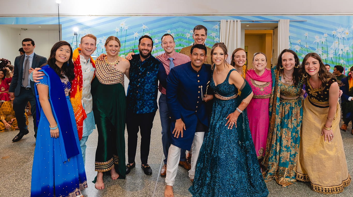 AG Pelham Mathur (Blue Dress, Center)