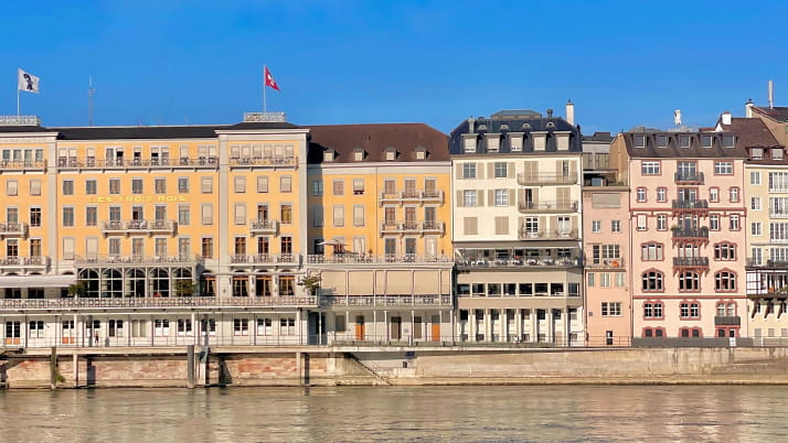 European-style rowhomes on a body of water.