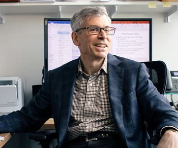 David Dranove, the Walter McNerney Distinguished Professor of Health Industry Management at Kellogg, sitting in his office