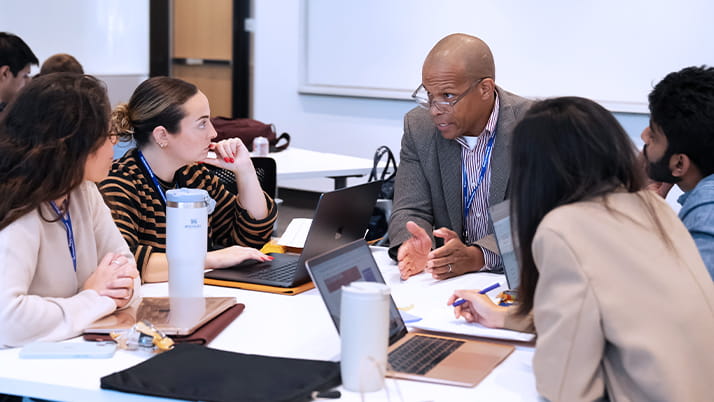 Dr. William Towns with Kellogg MBA students during Social Impact Days 2024