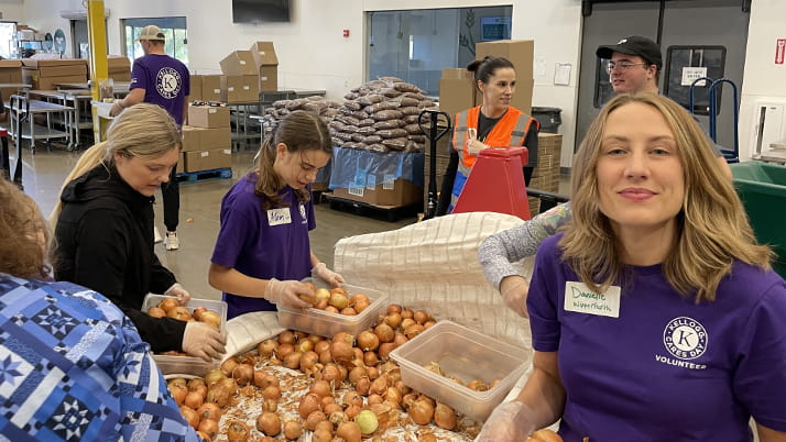 Minneapolis Kellogg Cares Day volunteer team helped pack meals for local families in need.