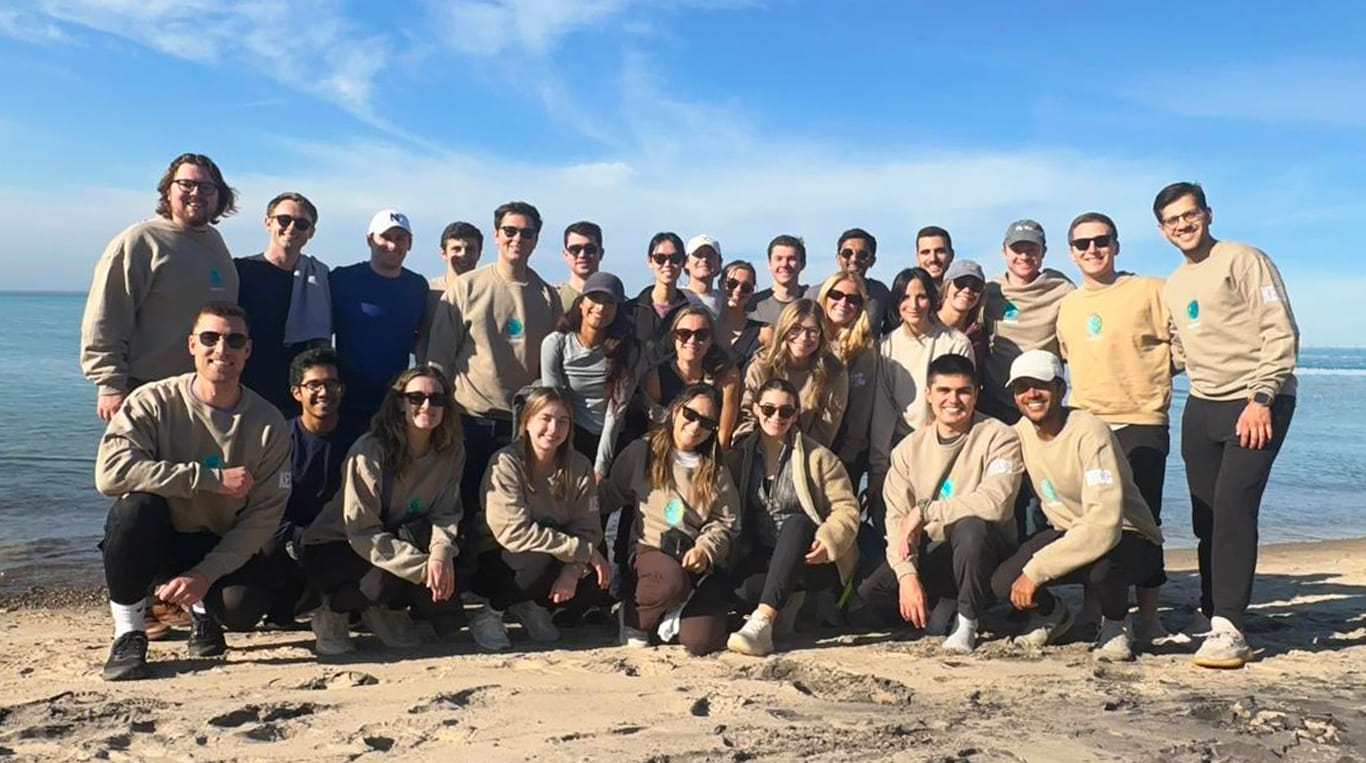 Kellogg Energy and Sustainability Club members in front of a lake