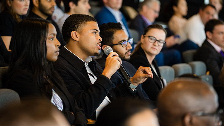 An attendee asking a question during the PE/VC Conference