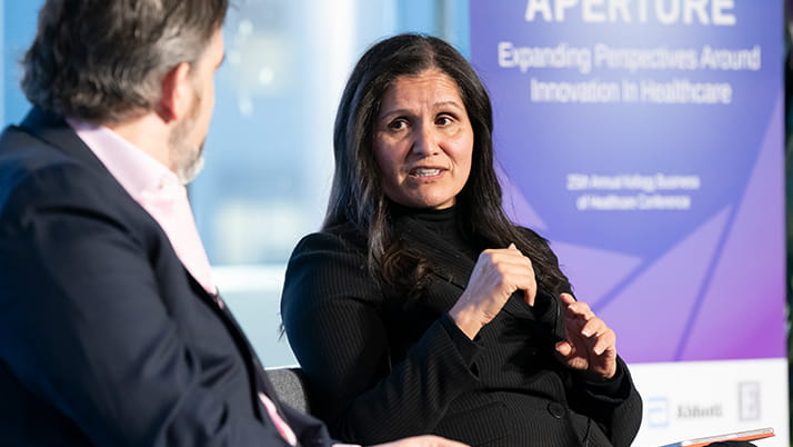 Lidia Fonseca, chief digital and technology officer at Pfizer, participating in a panel discussion during a healthcare business conference.