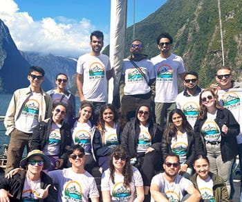 A group of Kellogg MBA students on a boat trip in New Zealand.