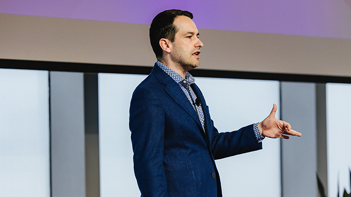 Professor Gregor Matvos gives a presentation on fintech and innovation during the Ward Center re:connect conference at the Kellogg Global Hub.