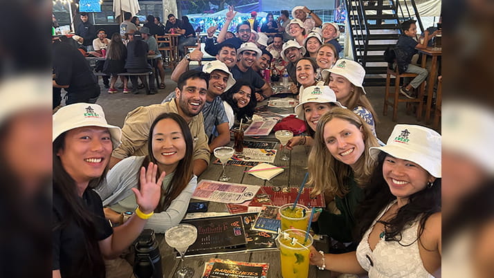 A group of MBA students eating together