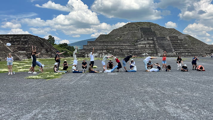 MBA students spelling Kellogg with their bodies
