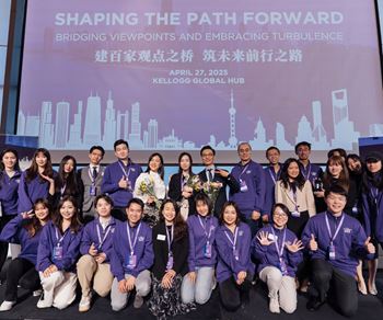 Kellogg MBA students pose on stage during the 2025 Greater China Business Conference