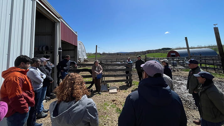 A group of MBA students at a farm