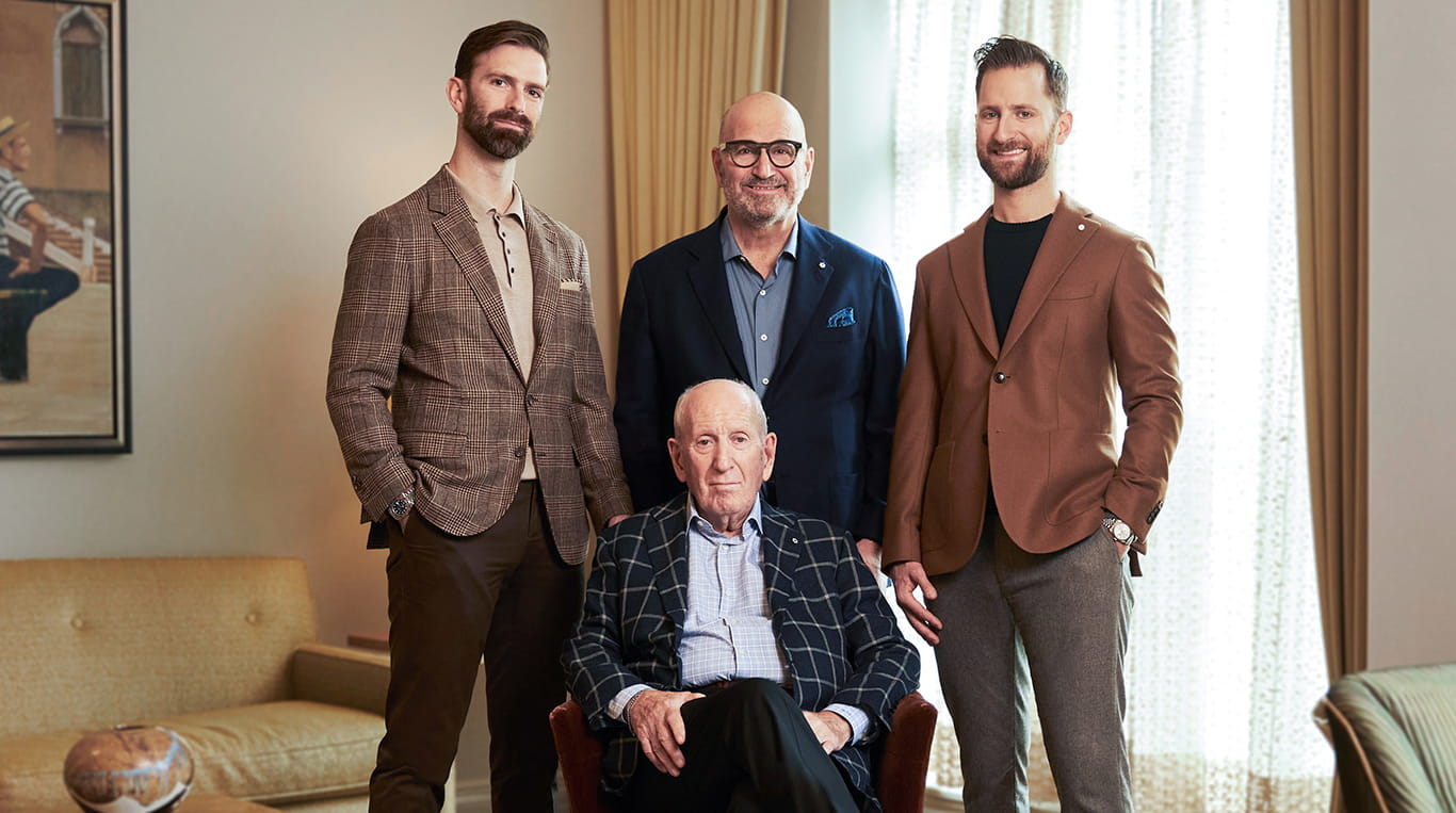 Three generations of the Rosen family pose with menswear chain founder Harry Rosen.
