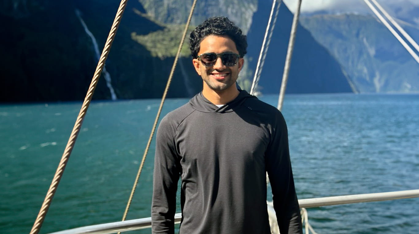 Kamran Ahmed, a Kellogg part-time MBA student, on a boat in New Zealand during his GIM trip.