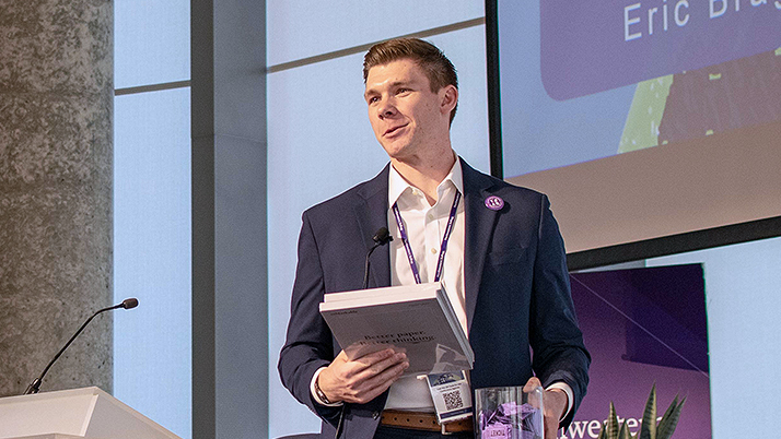 Eric Bragg, a Kellogg MBA graduate, addressing the crowd during the Climate Conference.