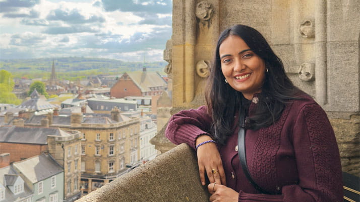 A woman resting her arm on a ledge