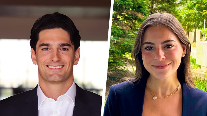 A smiling man wearing a white-collared shirt with a dark blazer on the right and on the left a woman with long, brunette hair wearing a purple blazer and trees behind her.