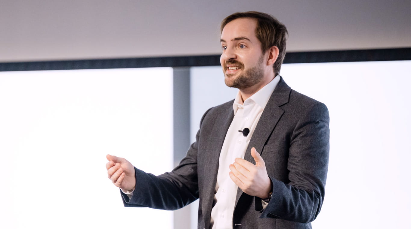 Man talking wearing sports coat