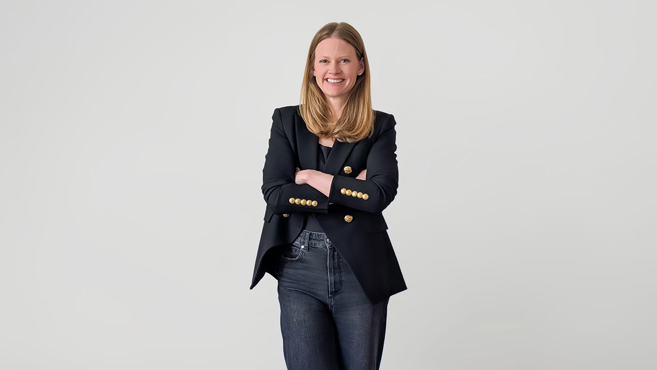 A woman standing for a portrait photo
