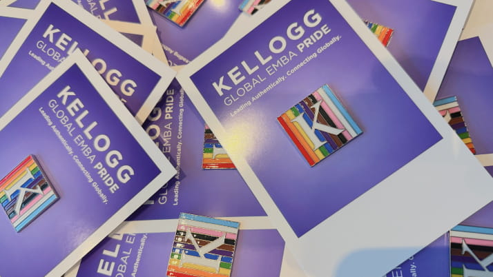 A small pin with the letter K against a colorful background