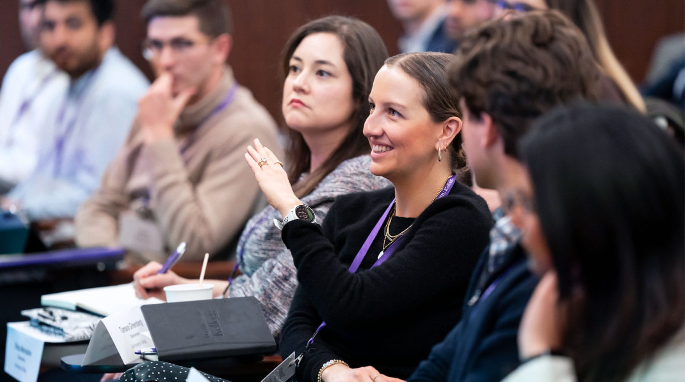 A mix of men and women seated in a classroom