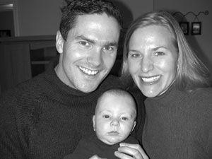 Stephanie and Paul Judy '00 with new baby