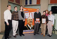 Dean Jacobs with giant Wheaties box and students.