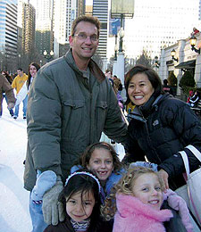 Though they live thousands of miles apart, Gary Dvorchak '92 and Julie (Yee) Carlucci '92 ran into each other in Millennium Park in December. Pictured are Gary with his two daughters, Alexandra (7) and Clarissa (5), and Julie with her daughter Isabella (5).