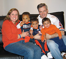 Rebecca '02 and John '97 Budd, on Super Bowl Sunday with Jackie, Caden and Melody