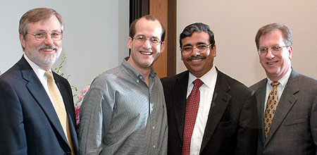 Constantinos Skiadas, center, with deans Magee, Jain and Korajczyk