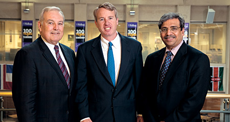 Chris Kennedy '94 (center) with Associate Dean for Alumni Relations Ed Wilson '84 (left) and Dean Dipak C. Jain