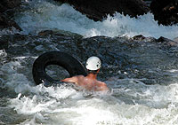 Jim Clark '97 contemplates his immediate future on the Poudre River.