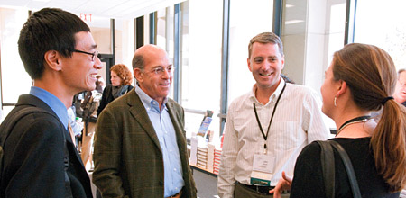 Andrew Youn '06, Larry Levy '67 and John Wood '89 interact with Sandra Anderson '07